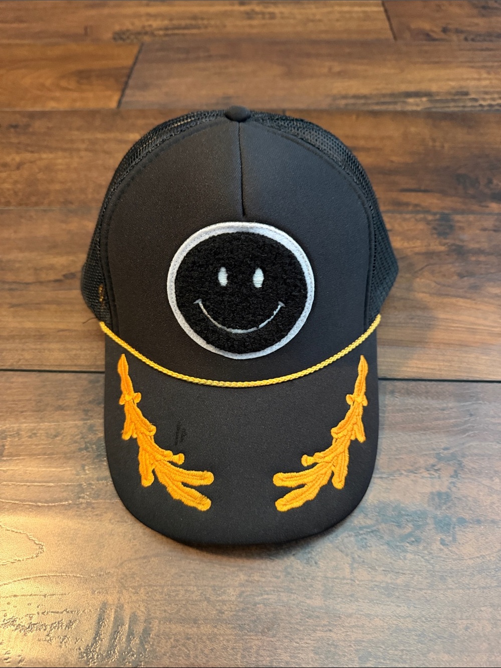 Men’s- Black Trucker Hat with Yellow Embroidery